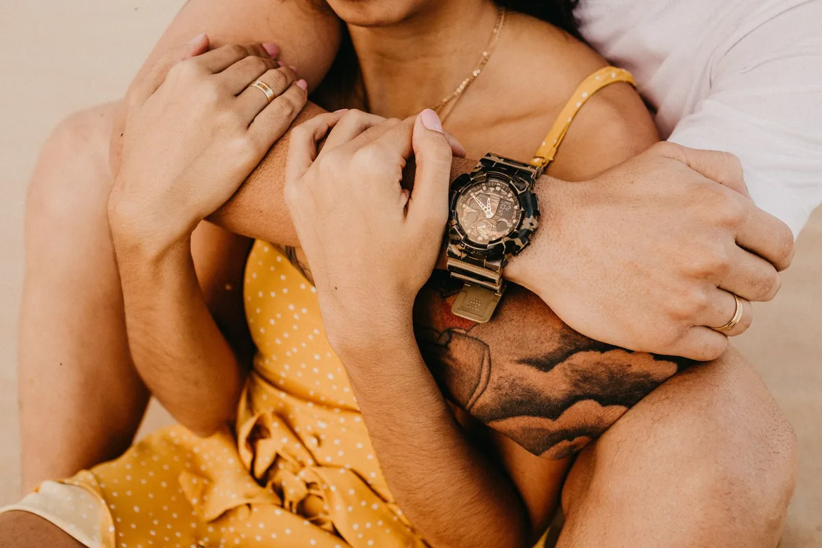 A couple in a warm, intimate embrace.